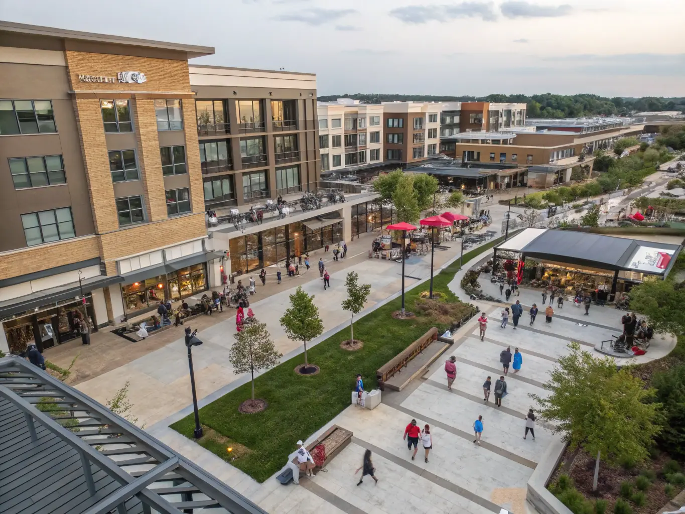 A photograph of a mixed-use development featuring both industrial and retail spaces, with modern architecture and green spaces, symbolizing Z Equity Group's commitment to sustainable and community-focused development.
