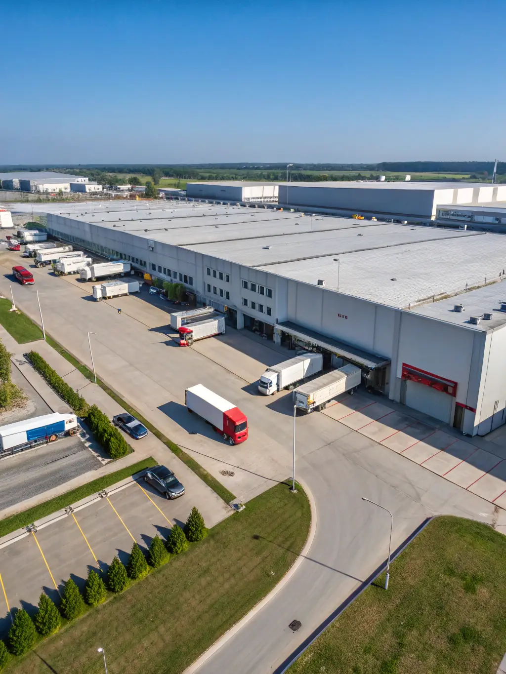 A modern small bay industrial center with multiple loading docks and ample parking, showcasing Z Equity Group's focus on functional and efficient industrial spaces.
